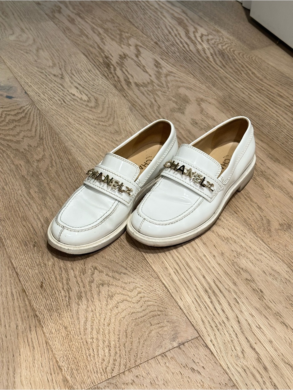 CHANEL Cream Leather Logo Chain Loafers